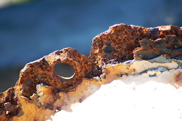 Rust Holes II &copy; Dennis Mojado
